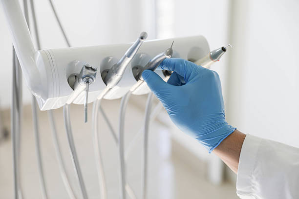 Professional Tooth Extraction technician working in San Carlos, TX